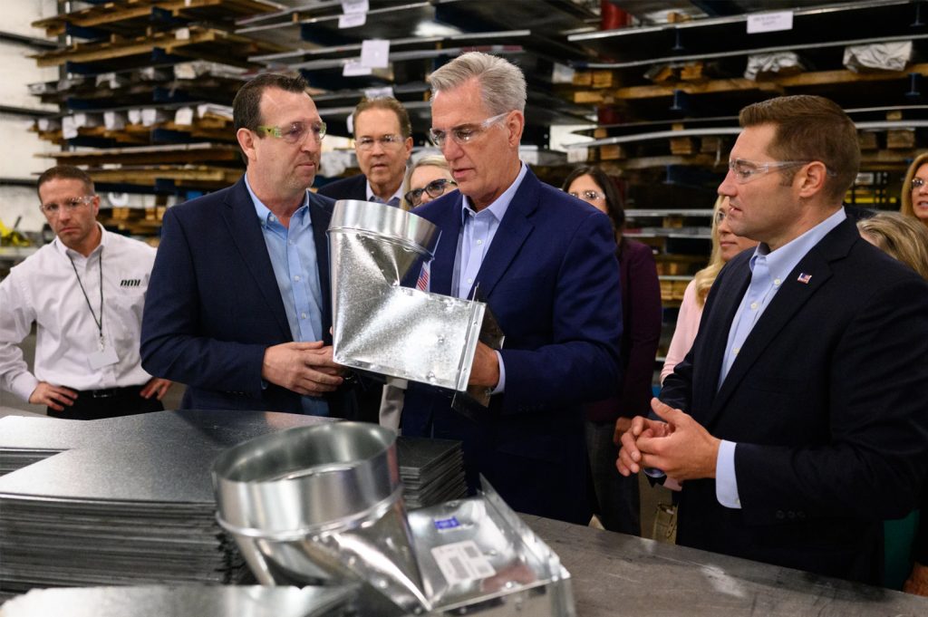 House Minority Leader Kevin McCarthy, R-Calif., looks at HVAC products as he tours DMI Companies in Monongahela, Pennsylvania.