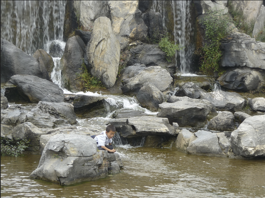 boy-in-pyongyang-nature-park-stream